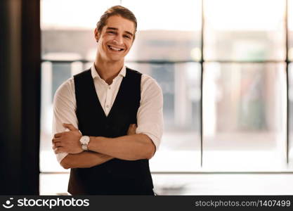 Portrait of a Young Confident CEO or Leader in the Office. Smiling Businessman in Comfortable Posture