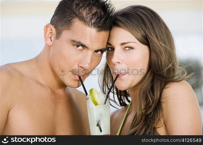 Portrait of a young couple drinking lemonade