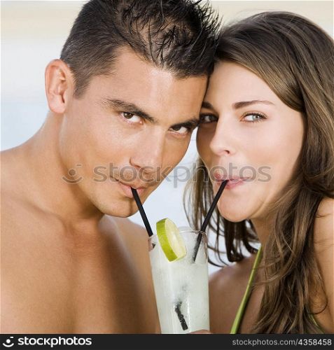 Portrait of a young couple drinking lemonade