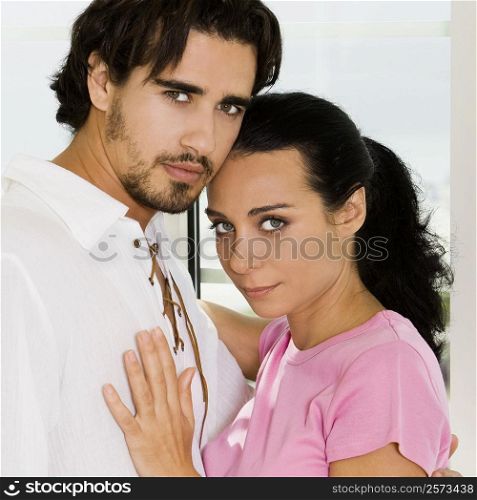 Portrait of a young couple embracing each other