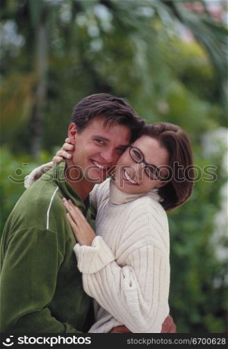 Portrait of a young couple hugging each other