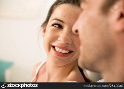 Portrait of a young couple looking to each other