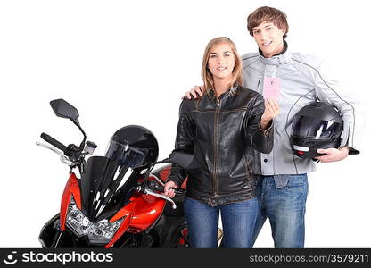 portrait of a young couple next to a motorbike