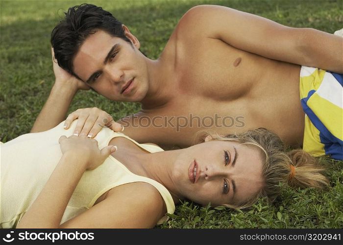 Portrait of a young couple on the grass