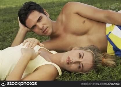 Portrait of a young couple on the grass