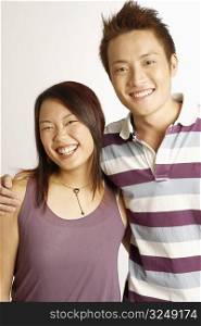 Portrait of a young couple posing and smiling