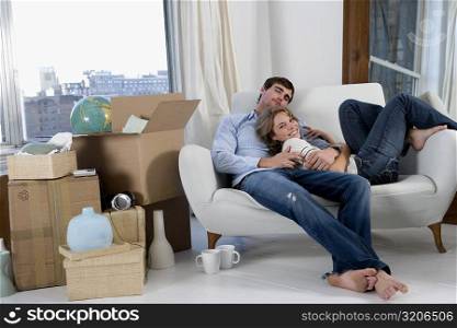 Portrait of a young couple resting on a couch