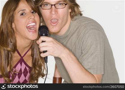 Portrait of a young couple singing together