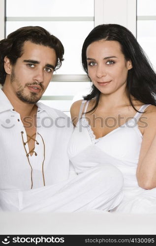 Portrait of a young couple sitting