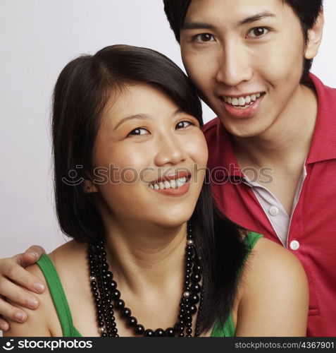 Portrait of a young couple smiling