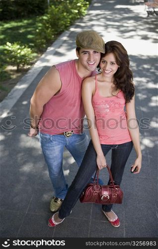 Portrait of a young couple standing together and smiling
