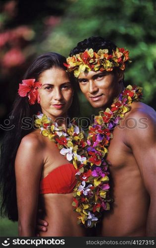 Portrait of a young couple standing together, Hawaii, USA