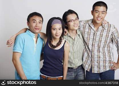 Portrait of a young couple standing with two mid adult men