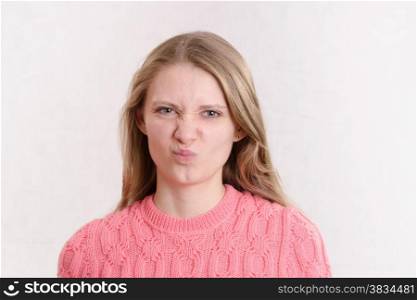 Portrait of a young emotional beautiful girl of the European appearance on a white background
