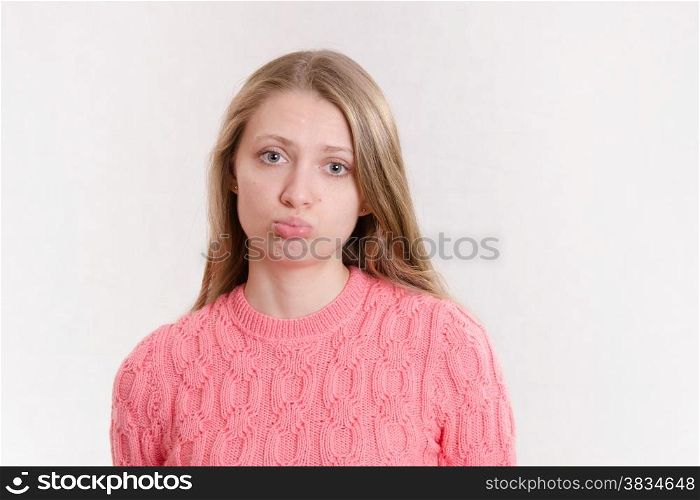 Portrait of a young emotional beautiful girl of the European appearance on a white background