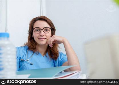 portrait of a young female doctor in his office
