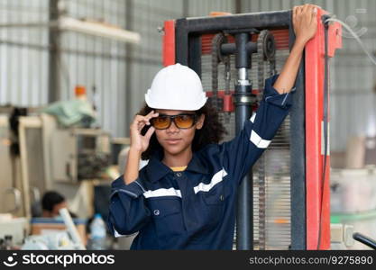 Portrait of a young female engineer in the welding robot industry, posed like a top model.