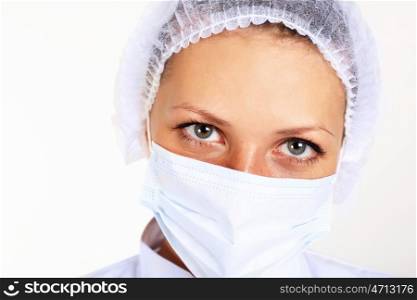 Portrait of a young female scientist wearing face mask