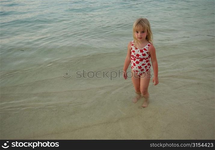 Portrait of a young girl (6-8) in water, Moorea, Tahiti, French Polynesia, South Pacific