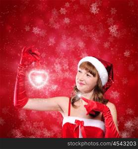 Portrait of a young girl dressed as Santa Claus on a red background. Happy New Year and Merry Christmas!
