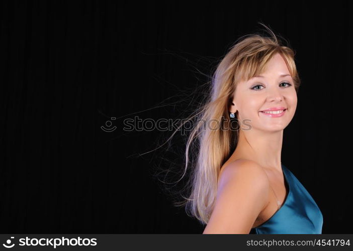 Portrait of a young girl on a black background