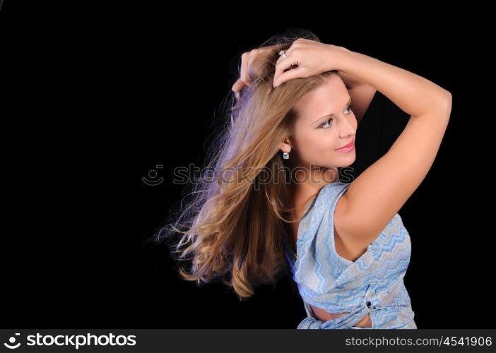 Portrait of a young girl on a black background