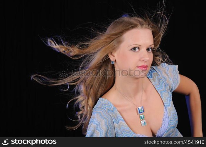 Portrait of a young girl on a black background