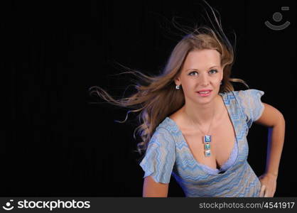 Portrait of a young girl on a black background