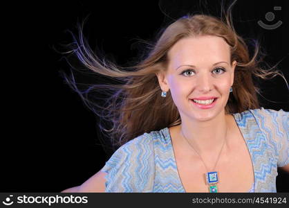 Portrait of a young girl on a black background