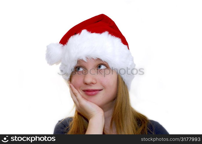 Portrait of a young girl wearing Santa&acute;s hat isolated on white background