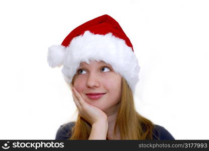 Portrait of a young girl wearing Santa&acute;s hat isolated on white background