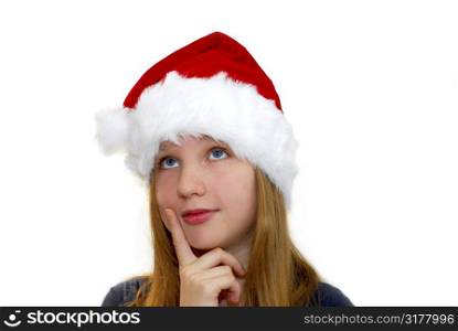 Portrait of a young girl wearing Santa&acute;s hat isolated on white background