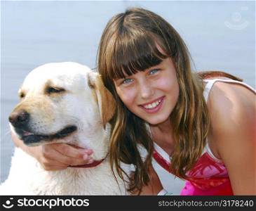 Portrait of a young girl with a dog