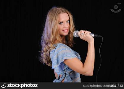 portrait of a young girl with a microphone
