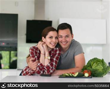 portrait of a young handsome couple in modern kitchen