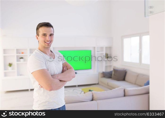 Portrait of a young handsome man enjoying free time at home