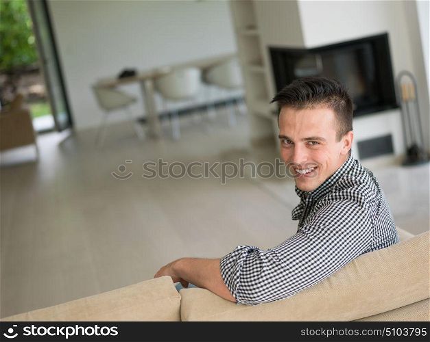 Portrait of a young handsome man enjoying free time in his luxury home villa