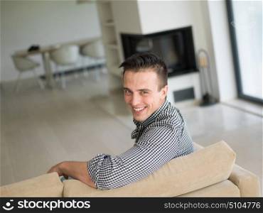 Portrait of a young handsome man enjoying free time in his luxury home villa