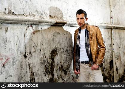 Portrait of a young handsome man in urban background
