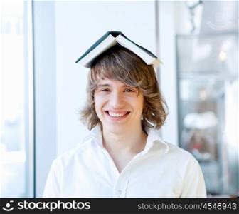 portrait of a young handsome man with a book