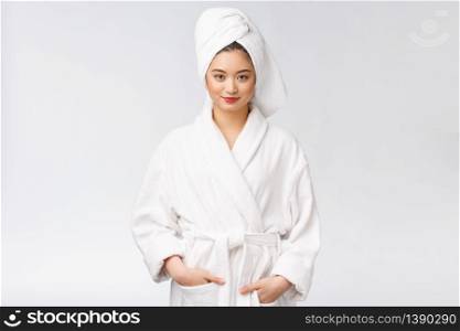 Portrait of a young happy asian lady in bathrobe.Isolated in white background. Portrait of a young happy asian lady in bathrobe.Isolated in white background.