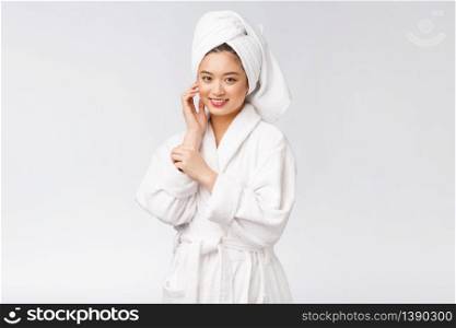 Portrait of a young happy asian lady in bathrobe.Isolated in white background. Portrait of a young happy asian lady in bathrobe.Isolated in white background.