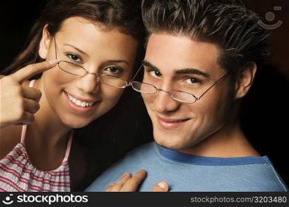 Portrait of a young man and a teenage girl smiling
