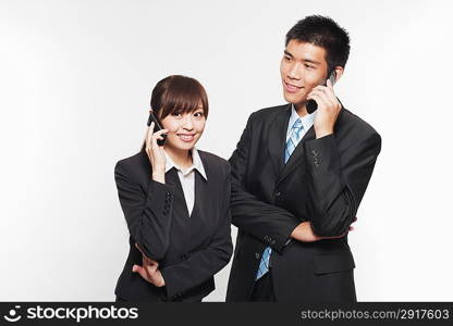 Portrait of a young man and woman telephoning