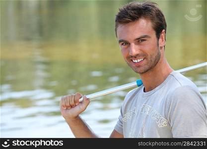 Portrait of a young man fishing