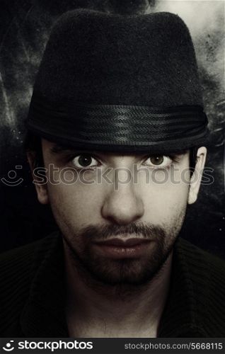 Portrait of a young man in a hat closeup