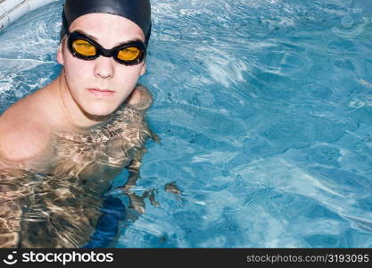 Portrait of a young man in a swimming pool