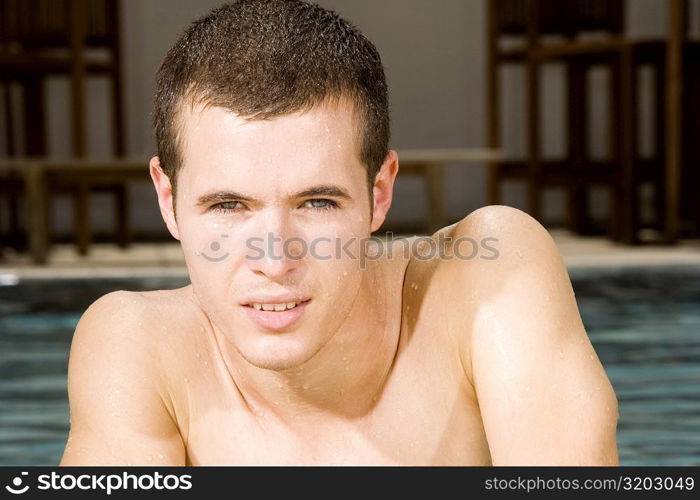 Portrait of a young man in a swimming pool