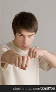 Portrait of a young man in boxing stance