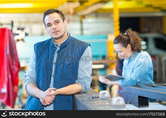 portrait of a young man in factory